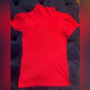 It is hot pink despite what may be pictured. Size Large but fits like a medium.